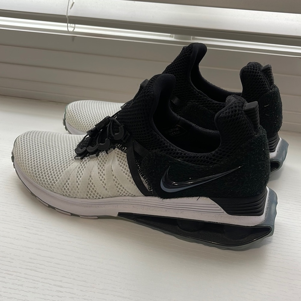 Men's Nike Shox Gravity black and white athletic shoes